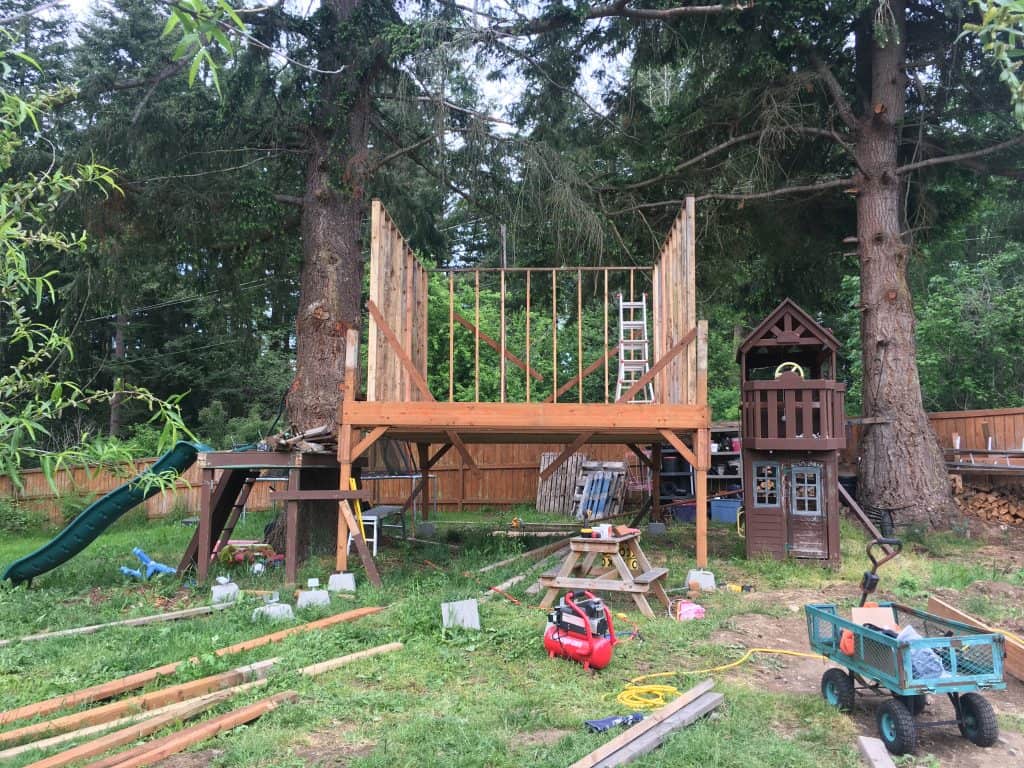 custom treehouse platform and wall framing going up