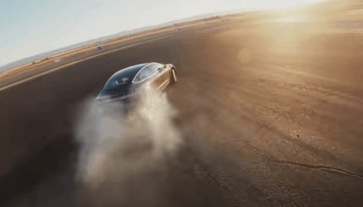 screen grab from the Tesla YouTube channel show a performance Model 3 drifting