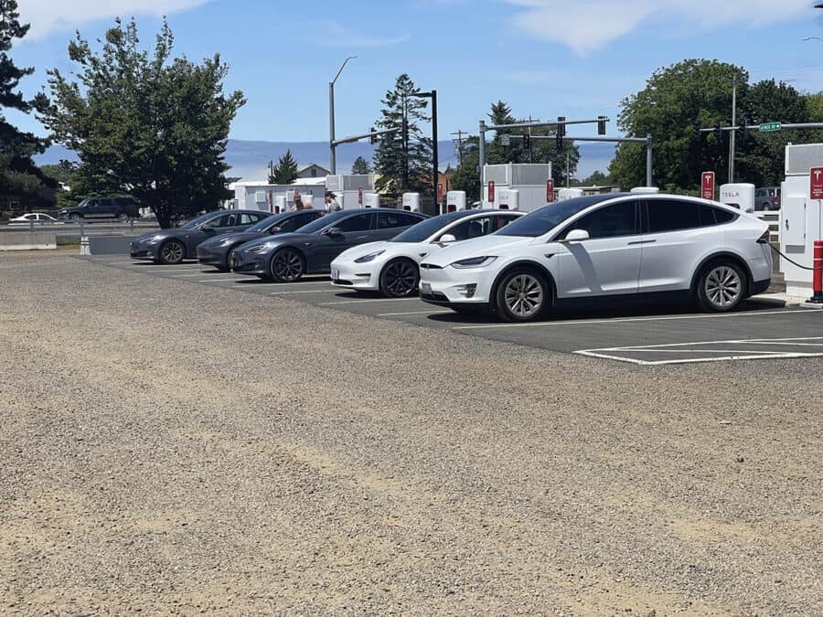 Several tesla's charging at a tesla supercharger network station in Tillamook, Oregon.